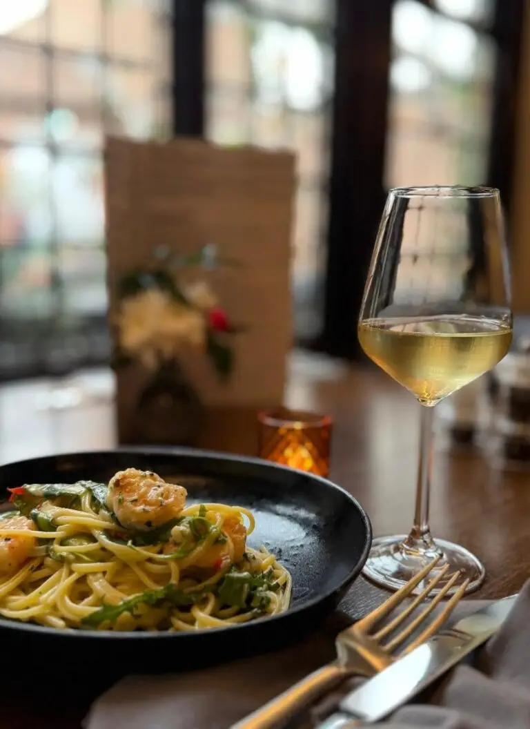 enjoying Spaghetti Solare with a glass of white wine @ La Piazza Antica, York